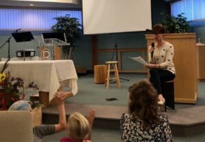 Kindra Silk Kreislers preaching a children's sermon on Jesus